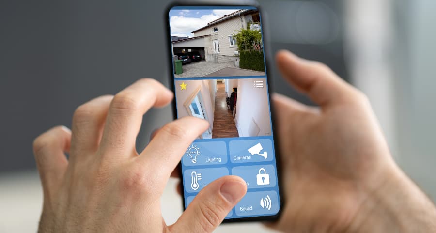 Homeowner examining video camera streams on a mobile device